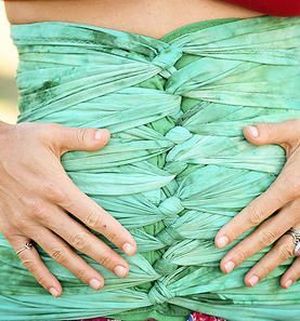 Bengkung belly binding is the art of wrapping a postpartum women's belly  for physical support and to help hasten the recovery process a